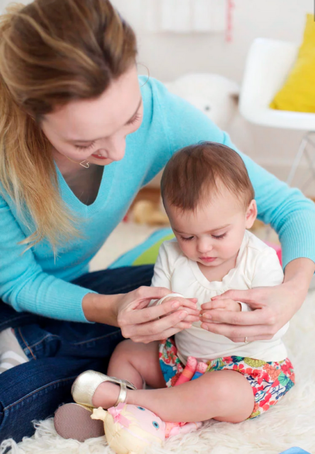 mother teaching baby to sign